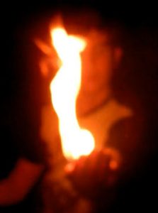 Child lighting hand on fire
