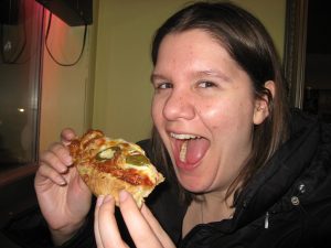 Happy Woman Eating Pizza